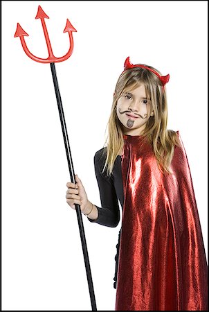 Portrait of a girl wearing a devil costume Foto de stock - Sin royalties Premium, Código: 640-01356991