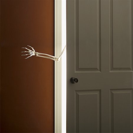 skeleton hand - Skeleton hand reaching through doorway Stock Photo - Premium Royalty-Free, Code: 640-01357046