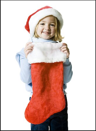 Portrait of a girl holding a Christmas stocking Stock Photo - Premium Royalty-Free, Code: 640-01357052