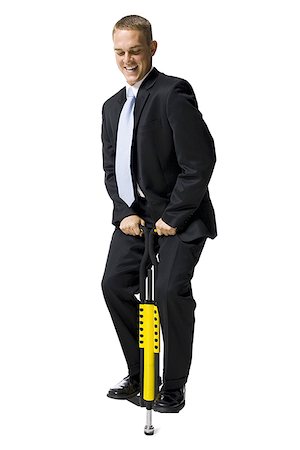 pogo stick - Homme d'affaires sur un pogo stick Photographie de stock - Premium Libres de Droits, Code: 640-01357087