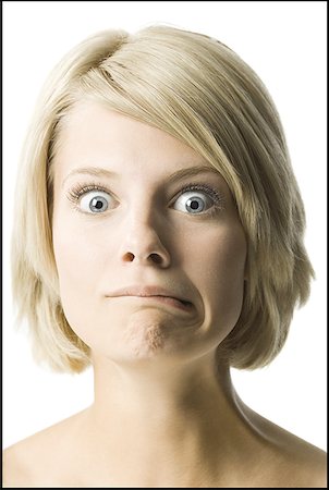 erro - Portrait of a young woman making a face Foto de stock - Royalty Free Premium, Número: 640-01357309