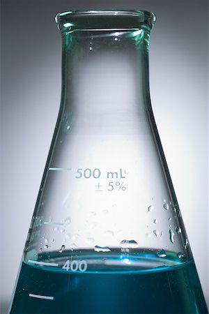 Close-up of beakers with colored liquid Stock Photo - Premium Royalty-Free, Code: 640-01357379