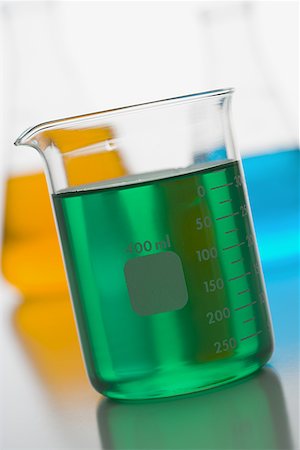 Close-up of a measuring beaker with green liquid Stock Photo - Premium Royalty-Free, Code: 640-01357480