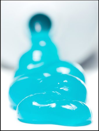 Close-up of toothpaste flowing out of a tube Stock Photo - Premium Royalty-Free, Code: 640-01357539