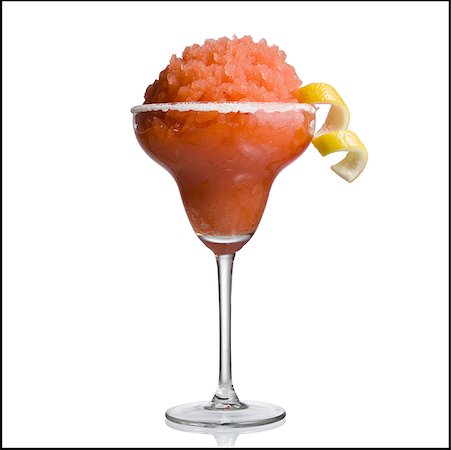 fruit garnish on cocktails - Red slush beverage in cocktail glass with lemon garnish Stock Photo - Premium Royalty-Free, Code: 640-01357593