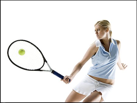 shot a goal - Low angle view of a young woman playing tennis Stock Photo - Premium Royalty-Free, Code: 640-01357613