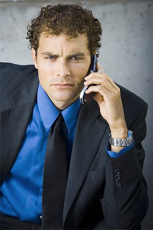 simsearch:640-02768119,k - Businessman talking on a mobile phone Fotografie stock - Premium Royalty-Free, Codice: 640-01357638