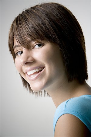 Portrait of a teenage girl smiling Stock Photo - Premium Royalty-Free, Code: 640-01357709