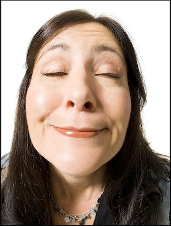 simsearch:640-02773811,k - Closeup of woman with funny face eyes closed Stock Photo - Premium Royalty-Free, Code: 640-01357780
