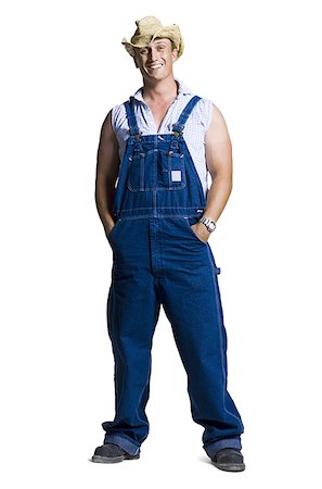redneck man - Farmer wearing a straw hat with hands in pockets Stock Photo - Premium Royalty-Free, Code: 640-01357800