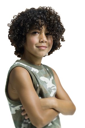 Portrait of a boy standing with her arms crossed Stock Photo - Premium Royalty-Free, Code: 640-01357924
