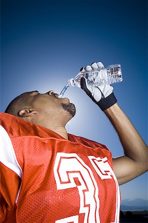 football players drinking gatorade