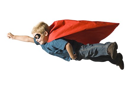 Young boy in superhero costume Stock Photo - Premium Royalty-Free, Code: 640-01358065