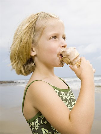 Girl with Ice Cream Cone at the beach Stock Photo - Premium Royalty-Free, Code: 640-01358104
