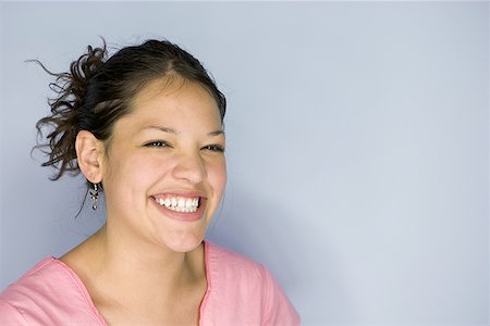 simsearch:640-01365245,k - Close-up of a teenage girl smiling Stock Photo - Premium Royalty-Free, Code: 640-01358132