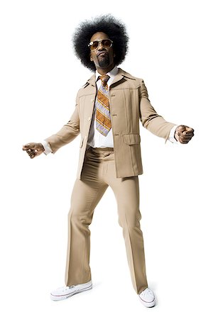 discotequero - Man with an afro in beige suit Foto de stock - Sin royalties Premium, Código: 640-01358133