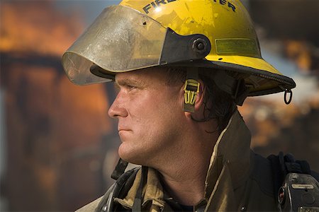 simsearch:640-01359145,k - Close-up of a firefighter looking sideways Stock Photo - Premium Royalty-Free, Code: 640-01358286