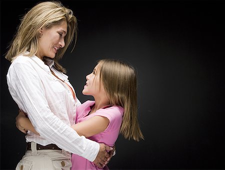 Portrait of a mother and daughter hugging Stock Photo - Premium Royalty-Free, Code: 640-01358408