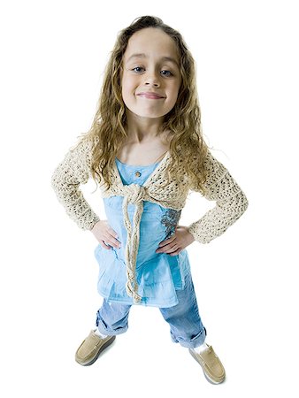shoe overhead on white - High angle view of a girl standing with her hands on her hips Stock Photo - Premium Royalty-Free, Code: 640-01358435