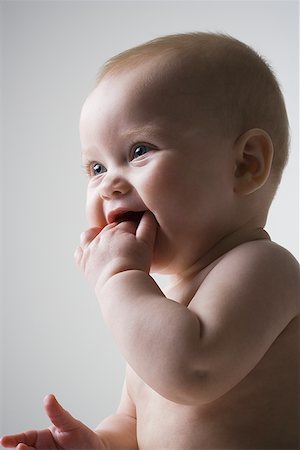 Profile of a baby girl smiling Stock Photo - Premium Royalty-Free, Code: 640-01358438