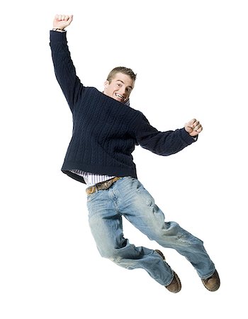 simsearch:640-01362955,k - Portrait of a young man jumping in mid air Foto de stock - Royalty Free Premium, Número: 640-01358454
