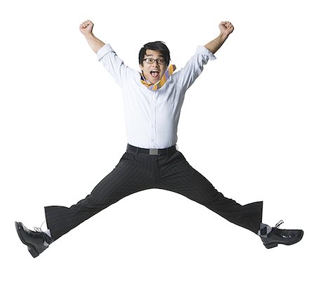 simsearch:640-01359391,k - Portrait of a businessman jumping in midair Foto de stock - Royalty Free Premium, Número: 640-01358537
