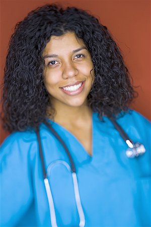 Portrait of a young woman smiling Stock Photo - Premium Royalty-Free, Code: 640-01358543