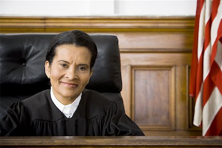 Portrait of a female judge smiling Stock Photo - Premium Royalty-Free, Code: 640-01358642