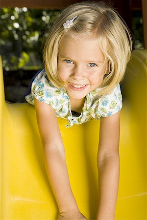 simsearch:640-01348953,k - Portrait of a girl lying on a slide Stock Photo - Premium Royalty-Free, Code: 640-01358673