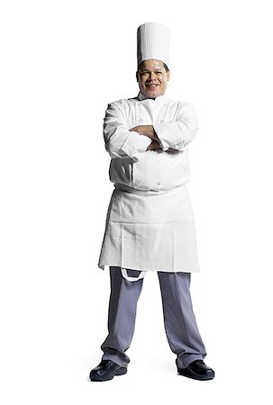 Portrait of a male chef standing with his arms folded Stock Photo - Premium Royalty-Free, Code: 640-01358713