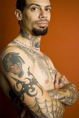 face man tatoo - Man with tattoos and crossed arms Stock Photo - Premium Royalty-Free, Code: 640-01358824