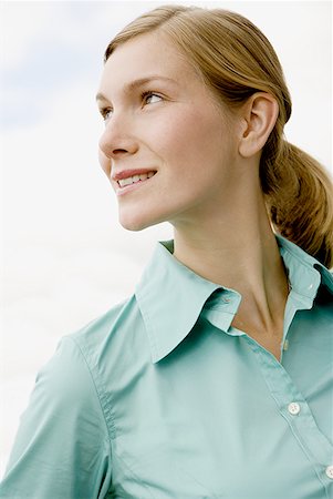 Close-up of a young woman looking sideways Stock Photo - Premium Royalty-Free, Code: 640-01358884