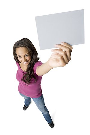 simsearch:640-01358649,k - Portrait of a young woman holding a blank sign Fotografie stock - Premium Royalty-Free, Codice: 640-01359143
