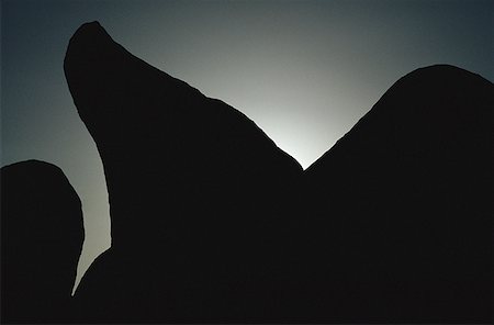 simsearch:640-01361581,k - Silhouette of a rock formation at dusk Fotografie stock - Premium Royalty-Free, Codice: 640-01359246