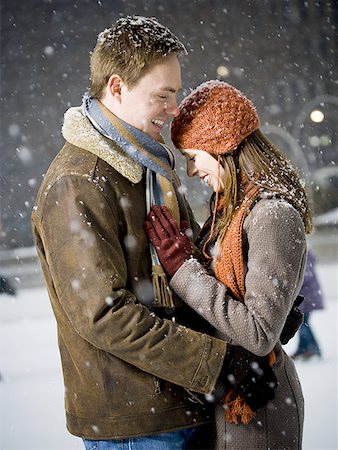 simsearch:640-02772458,k - Couple embracing outdoors in winter Stock Photo - Premium Royalty-Free, Code: 640-01359276