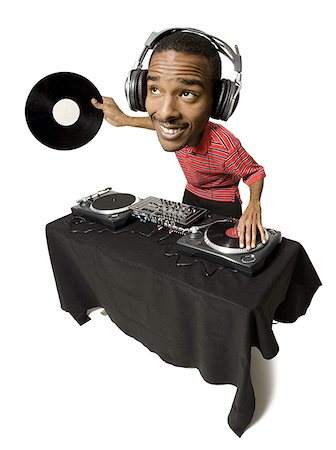 Caricature of DJ with headphones and records looking up Stock Photo - Premium Royalty-Free, Code: 640-01359285