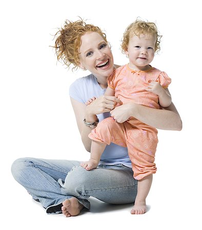 simsearch:640-01354168,k - Portrait of a young woman and her daughter smiling Fotografie stock - Premium Royalty-Free, Codice: 640-01359429