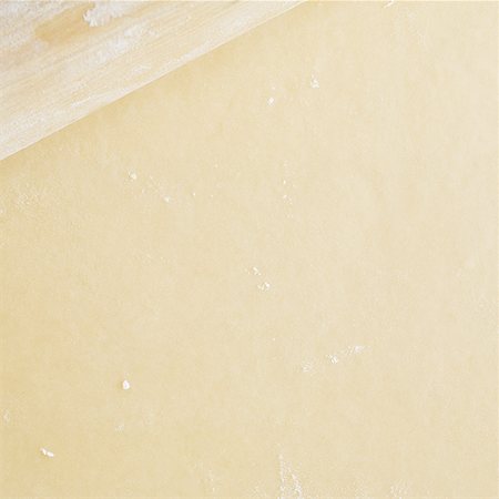 simsearch:640-02772561,k - Detailed view of dough with rolling pin Stock Photo - Premium Royalty-Free, Code: 640-01359497