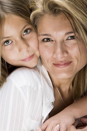 Portrait of a daughter hugging her mother Stock Photo - Premium Royalty-Free, Code: 640-01359506