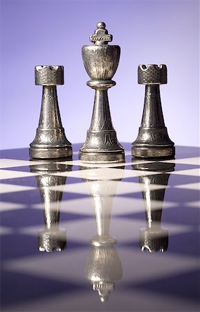 simsearch:640-01351370,k - Close-up of chess pieces on a chessboard in a row Stock Photo - Premium Royalty-Free, Code: 640-01359608