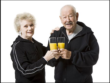 simsearch:640-01358490,k - Older couple in track suits taking a juice break Stock Photo - Premium Royalty-Free, Code: 640-01359601