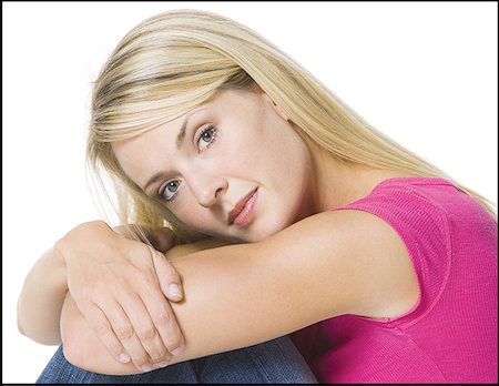 simsearch:640-01365857,k - Portrait of a young woman hugging her knees Stock Photo - Premium Royalty-Free, Code: 640-01359678