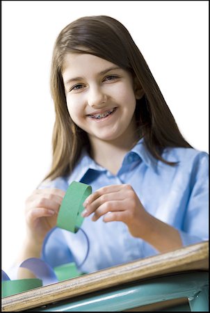 paper cutout chain - Portrait of a teenage girl smiling Stock Photo - Premium Royalty-Free, Code: 640-01359686