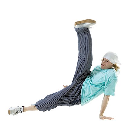 Profile of a young man break dancing Stock Photo - Premium Royalty-Free, Code: 640-01359695