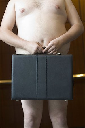 simsearch:640-01364192,k - Mid section view of a naked businessman holding a briefcase Foto de stock - Royalty Free Premium, Número: 640-01359775