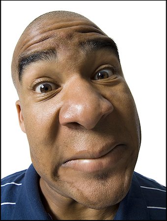 funny faces african american - Man making a funny face Stock Photo - Premium Royalty-Free, Code: 640-01359807