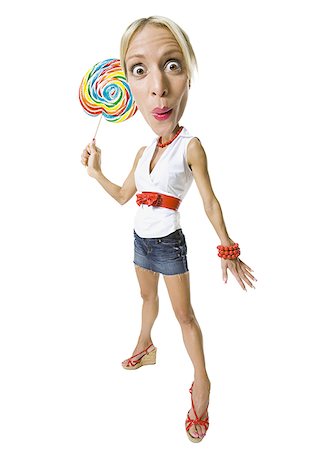Portrait of a young woman holding a lollipop Foto de stock - Sin royalties Premium, Código: 640-01359836