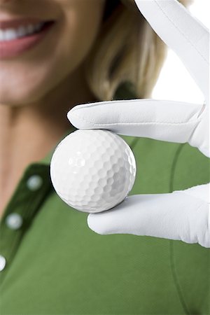 simsearch:640-03264970,k - Female golfer and close-up of golf ball Stock Photo - Premium Royalty-Free, Code: 640-01359900