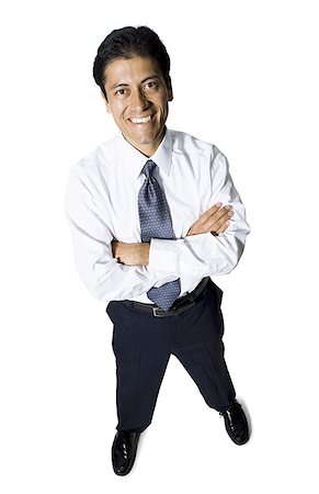 simsearch:640-03263616,k - Businessman with arms crossed looking up smiling Stock Photo - Premium Royalty-Free, Code: 640-01359921