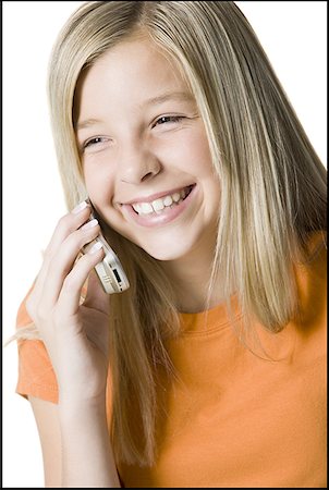 Close-up of a girl talking on the phone Stock Photo - Premium Royalty-Free, Code: 640-01359941